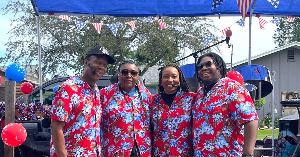 Gratitude Steel Band in Red Hawaiian shirts smiling