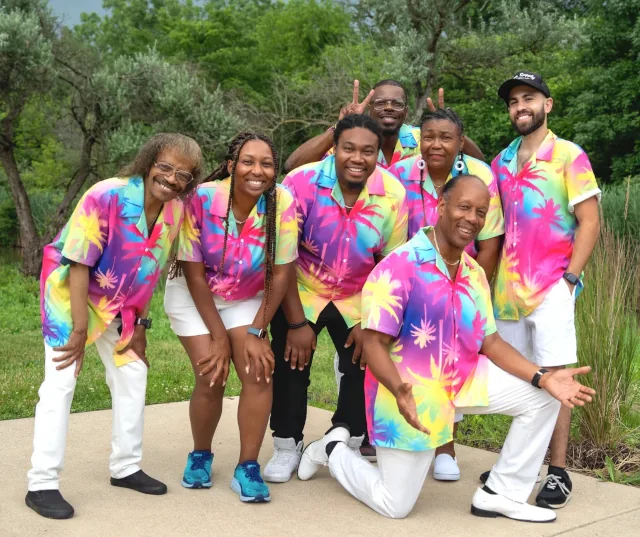 members of Gratitude Steel Band in colorful Hawaiian shirts smiling